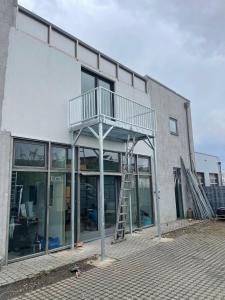 a building with a staircase on the side of it at Hotels-in-Alsdorf in Alsdorf