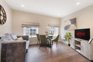a living room with a couch and a table at Flat4 1BR in Horsemarket in Barnard Castle
