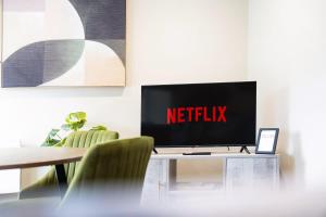 a television on a table with the netflix sign on it at Flat4 1BR in Horsemarket in Barnard Castle
