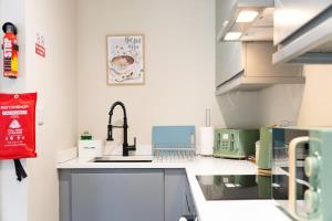 a kitchen with a sink and a faucet at Flat4 1BR in Horsemarket in Barnard Castle +20 photos