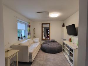 a living room with a couch and a bed in it at Leichlingen 1 in Leichlingen