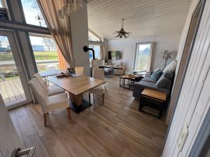 a living room with a table and a couch at Seeschwalbe 78 in Rechlin