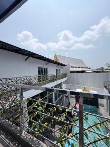 a view of a balcony with plants on it at The Lion King Villa in Ban Na