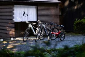 two bikes parked in front of a building at YADO SEN -仙- Komatsu in Komatsu