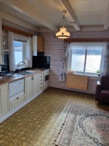 a kitchen with a sink and a counter top at Nordfjord Charm in Stårheim