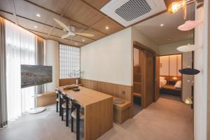a room with a table and chairs and a bedroom at 아랑재 arangjae in Seoul