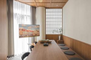 a conference room with a long table and a large window at 아랑재 arangjae in Seoul