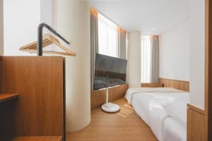 a bedroom with a bed and a large window at 아랑재 arangjae in Seoul +198 photos