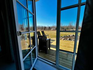 a view of a porch from an open window at Vahtralehe majutus in Tartu