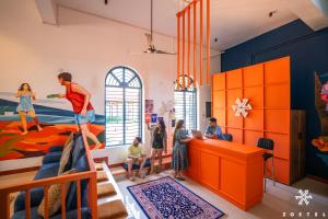 a childrens room with a mural on the wall at Zostel Varkala in Varkala
