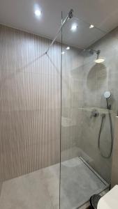a shower with a glass door in a bathroom at Aqua Villa 4 in Jurata +18 photos
