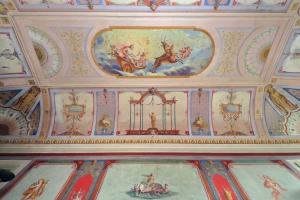 a room with a ceiling with paintings on it at Hotel Palazzo Vittoria Heritage Collection in Cerveteri