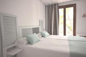 Posteľ alebo postele v izbe v ubytovaní Houm Villa Plaza Arosa