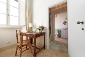 a room with a desk and a chair and a window at Hotel Palazzo Vittoria Heritage Collection in Cerveteri +84 photos