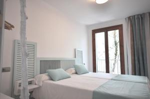 Posteľ alebo postele v izbe v ubytovaní Houm Villa Plaza Arosa