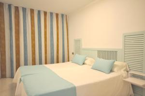 Posteľ alebo postele v izbe v ubytovaní Houm Villa Plaza Arosa
