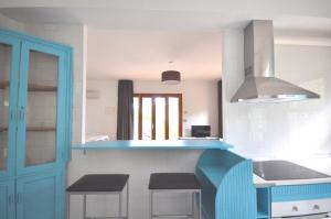 Kuchyňa alebo kuchynka v ubytovaní Houm Villa Plaza Arosa