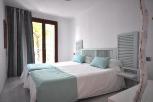 Posteľ alebo postele v izbe v ubytovaní Houm Villa Plaza Arosa