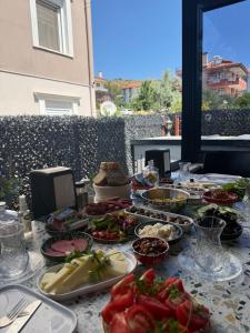 a table with a bunch of food on it at Ayvalik Bir Tebessum in Ayvalık +195 photos