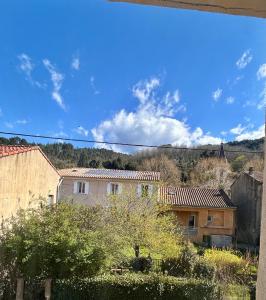 a view of some buildings and a blue sky at Coeur Cevennes in La GrandʼCombe