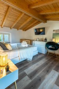 a bedroom with a large bed and a desk at B&B Il Podestà in Garbagna