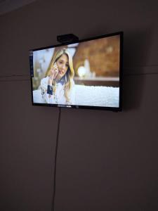 a flat screen tv hanging on a wall at J&J Paradise Guesthouse in Pietermaritzburg