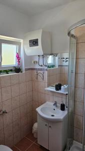 a bathroom with a sink and a shower at House Nena in Bibinje +36 photos