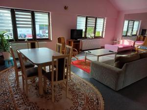 a living room with a table and a couch at ivlo in Pszczyna