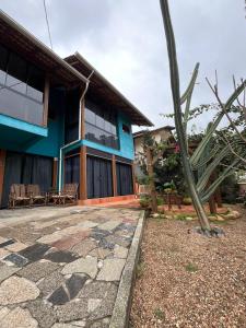 a house with a stone walkway in front of it at Suite Familia A1 in Pomerode
