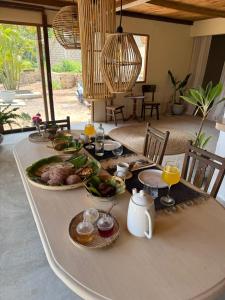 a table with plates of food on top of it at Lahima Cabanas Villa in Dickwella +40 photos