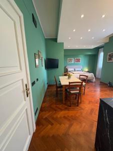 a room with a table and chairs and a bedroom at CuordiSole Tuscany in Montopoli in Val dʼArno