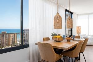 a dining room with a table and chairs with a view at Luxury Beachfront "Felicità" Sea View 6 Guests in Arenales del Sol