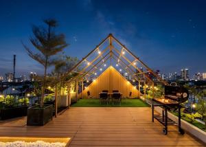 a large building with a deck at night at Gió Villa in Ấp Sơn Hải