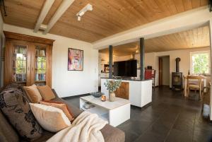 a living room with a couch and a table at Klaushausen Ferienoase in Überlingen