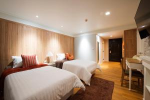 Llit o llits en una habitació de DoiTung Lodge