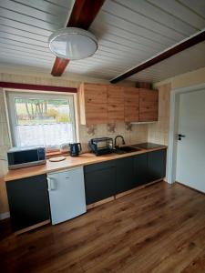 a kitchen with a sink and a counter top at Beskidzka Oaza in Targanice