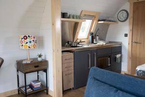 a kitchen with a sink and a counter top at Appin's Coorie Nook in Appin +40 photos