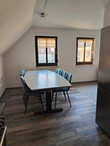 an empty room with a table and chairs at Ferienwohnung Zentrum Luckau in Luckau