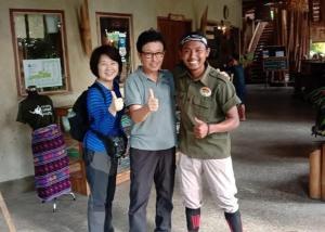 a group of three people posing for a picture at Sumatra Orangutan Discovery Villa in Bukit Lawang