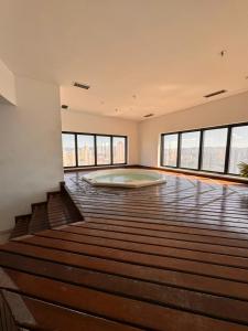 a large room with a mattress on the floor at MN Gotado Hotel Flat Guarulhos Aeroporto in Guarulhos