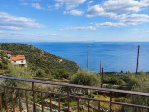 a view of the ocean from a balcony at Sea View House B in Péra Mélana