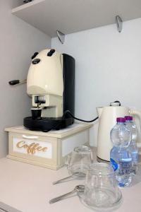 a coffee maker sitting on top of a counter at Sicily Luxury Suites in Palermo