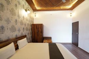 a bedroom with a bed in a room at The Kandarp Villa in Jaipur +4 photos