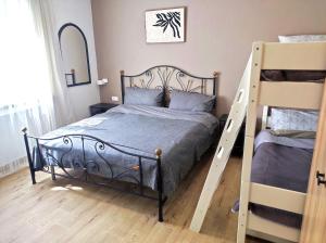 a bedroom with a bed and two bunk beds at 50 Special in Pontedera
