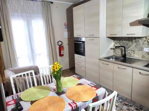 a kitchen with a table with chairs and a dining room at 50 Special in Pontedera