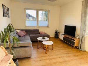 a living room with a couch and a table at Haus Eva in Groß Gusborn