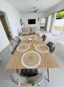 a large wooden table in a living room at Villa Le Caprice in Grand-Baie
