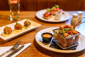 two plates of food on a wooden table at The Crown Hotel in Lynton