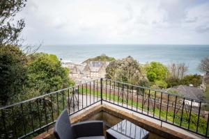 a balcony with a view of the ocean at Verity and Ilfracombe Harbour View in Barnstaple