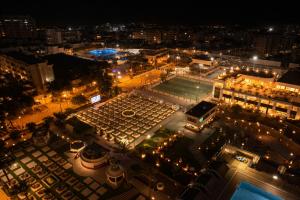 an aerial view of a city at night at Grand Tibarose Hotel in Cairo